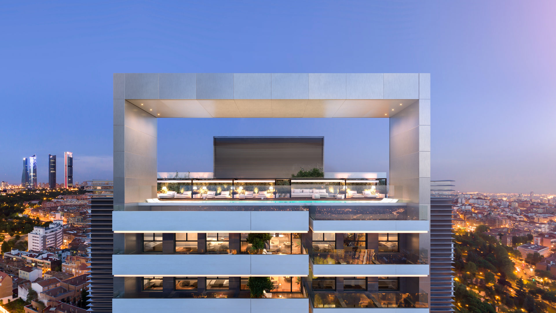 Frontal view of the panoramic rooftop swimming pool with the four towers in the background